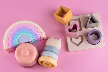 Baby soft nesting sorting ans stacking toy for arranging by color and geometric shape. Silicone...