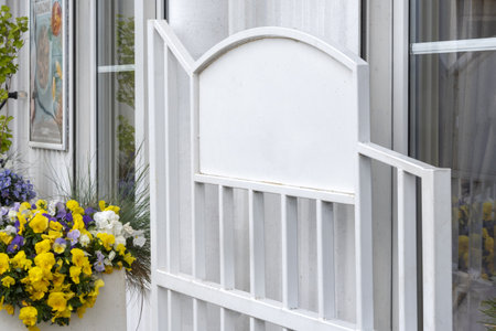 Empty metal board outdoors. Horizontal signage on restaurant or store front with glass windowsの写真素材