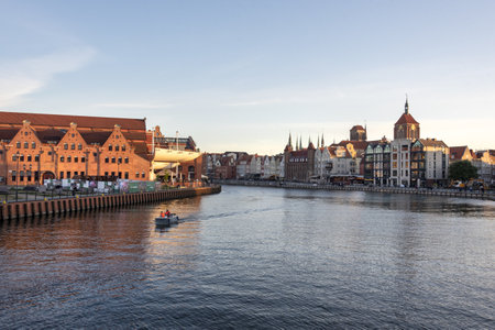 Gdansk, Poland - May 22, 2022: Old town of Gdansk at Motlawa river, Poland, evening light. Cityscape...