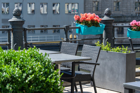 Empty table in outdoor cafe or restaurant. Tables and chairs at sidewalk cafe. Touristic setting, cafe table, sidewalk cafe furnitureの写真素材