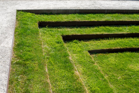 Minimalist landscape design with green grass steps.の写真素材