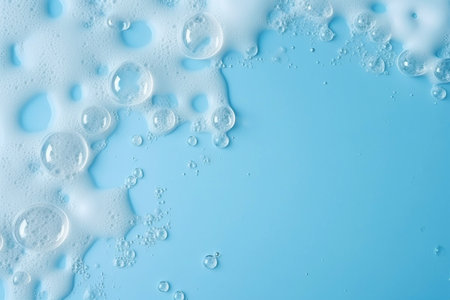 Soap foam, blue water surface texture with bubbles and splashes. Clear water abstract nature background, copy space for text.の素材