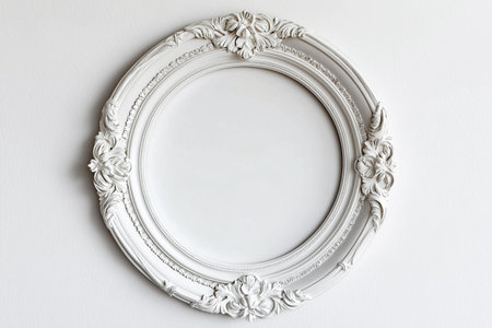 Baroque round ornate frame with an elegant flower motif background. A detailed white vintage round frame with floral ornamentation on white background. Mockup with copy space for text.の素材
