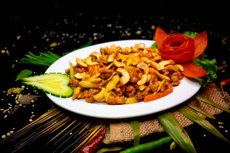 stir fried macaroni with cashew nuts on wooden backgroundの写真素材