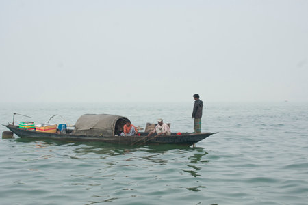 Fishermen in the boat on the sea in the morning.の写真素材
