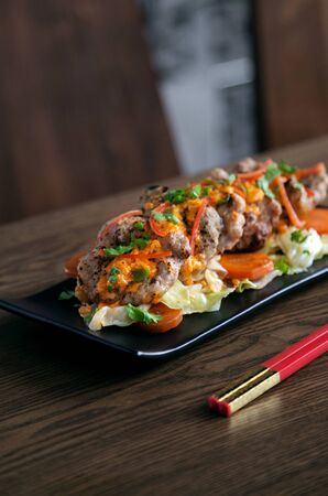 Thai Fusion Food Menu Grill Pork shrimp oil serve with saladの写真素材
