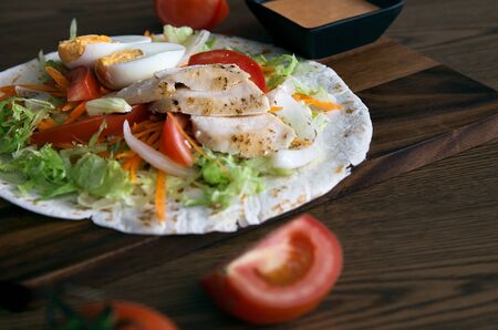 Chicken Burrito Top with Salsa or sour creamの写真素材