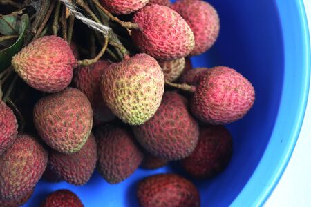 Litchi, lichee, lychee, or ripe litchi on bright colorful background with copy spaceの写真素材