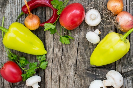Vegetable set on a wooden background. Top viewの写真素材