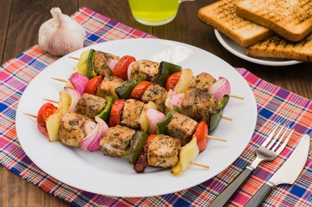 Skewers of chicken and vegetables on wooden skewers.の写真素材