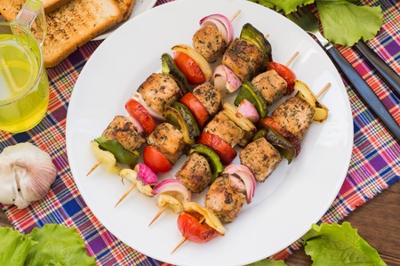 Skewers of chicken and vegetables on wooden skewers.の写真素材