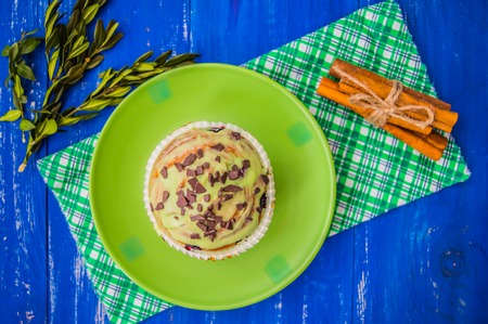 Green Chocolate muffin on a blue wooden background. Top viewの写真素材