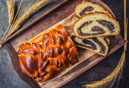 Poppy seed cake on a wooden background