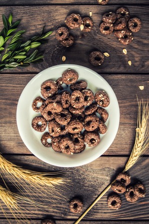 Breakfast with muesli. On a wooden background. Top viewの写真素材