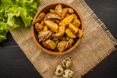 Baked potato in village. On a black background. Top viewの写真素材
