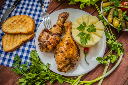 Fried chicken legs. Wooden rustic background. Top viewの写真素材