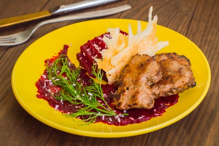 Roast beef with berry sauce, slices of cheese and chips Buriak. Wooden background. Top view. Close-upの写真素材
