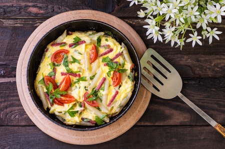 Frittata in Italian on a wooden table. Top viewの写真素材