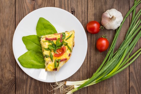 Frittata in Italian on a wooden table. Top viewの写真素材