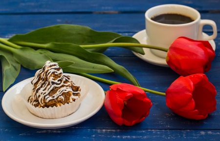 Cake with flowers. Romantic atmosphere. Wooden blue tableの写真素材