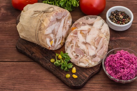 Aspic with meat and horseradish on a wooden tableの写真素材