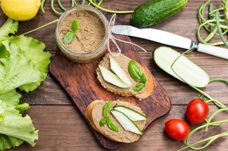 Liver pate with baguette. On a wooden rustic backgroundの写真素材