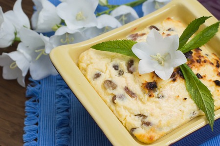 Curd pudding with raisins. Wooden rustic table.の写真素材