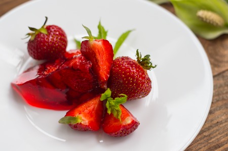 Jelly with strawberries. On a wooden rustic background. Close-upの写真素材