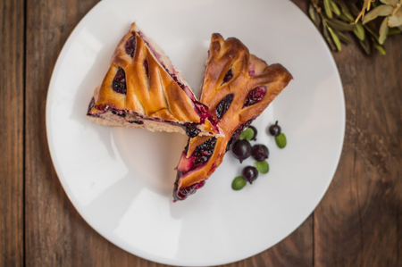 sweet pie with berries assorted, cherry, strawberry, blueberry, Apple, currants. Wooden background. Top view. Close-upの写真素材