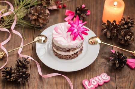 Cherry sponge cake with cream and red currant. Wooden background. Top view. Close-upの写真素材