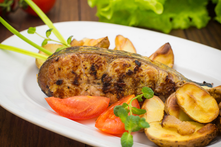 Deep Fried Dolly Fish Steak with French fries. Wooden background. Top view. Close-upの写真素材