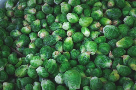 Brussel sprout vegetables for sale on market. Agriculture background. Top view. Close-upの写真素材