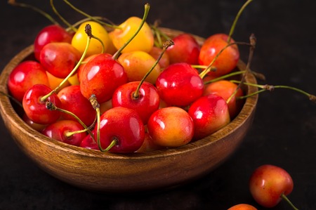 Cherry isolated on black background. Agriculture. Top view. Close-upの写真素材