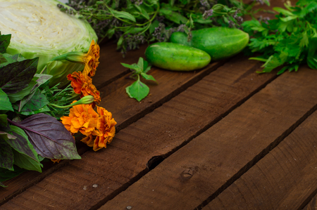 Greens on a wooden background. Close-up. Top viewの写真素材