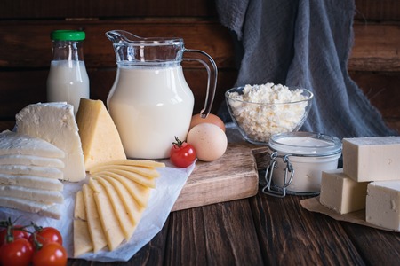 Farmers food products: milk, cream, cheese, eggs, cottage butter Rustic composition Organic food conceptの写真素材