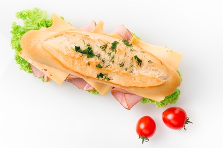 Sandwich with ham and vegetables isolated on white background.