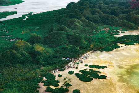 Aerial view on beautiful lagoons karst landform and green mangrove tropical forest, swamp line in Siargao island, the Philippines.の写真素材