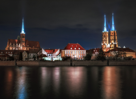 The view on the night a cityscape cathedral, river Odra. Wroclaw, Poland, duskの写真素材