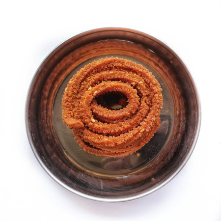 Chakali or murukku or chakri is diwali festival cutural snack serve as refreshment snacks for...