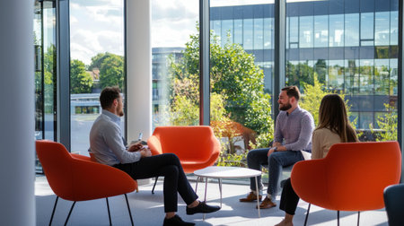 Group of young business people discussing business plan  in the modern officeの素材