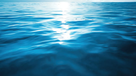 Blue water surface with sun reflection. Abstract nature background. Copy space.の素材