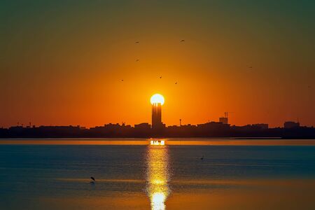 Beautiful Sunrise view in seaside with red and dark sky. Dammam -Saudi Arabiaの写真素材