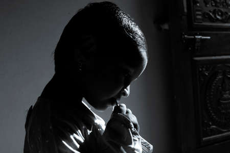 Kalaburagi, Karnataka/India-September 24 2020: closeup shot of girl child having food in morning sunlight at homeのeditorial素材