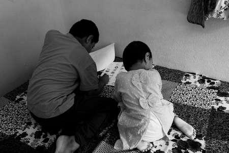 Kalaburagi, Karnataka/India-September 24 2020: kids home working for home in pandemic situationのeditorial素材