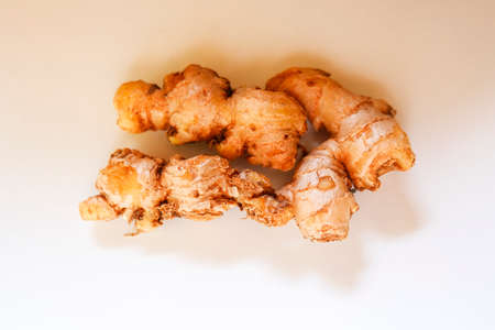 a top shot of fresh ginger group on plain white background