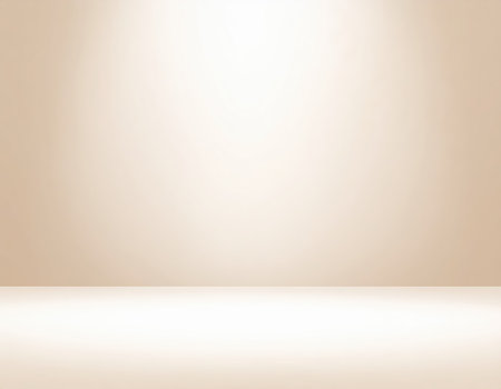 Empty studio room with light beige gradient background for product display.の素材