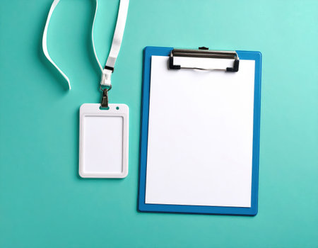 Blank clipboard with blank paper tag on blue background, top viewの素材