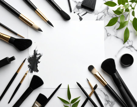 Flat lay composition with professional makeup brushes and blank cardle backgroundの素材