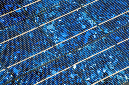 Blue shining solar panel in close up for background; Use of solar energy; Alternative energy productionの写真素材
