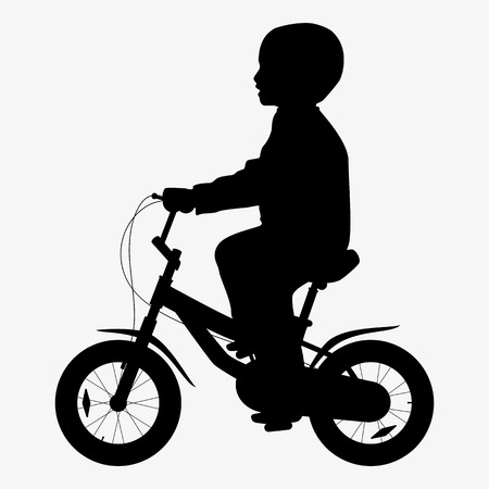 A boy rides a bicycle silhouetteの写真素材